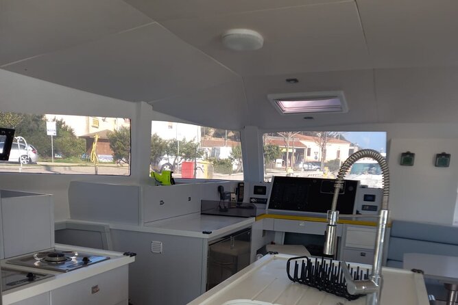 Excursion to Asinara Stintino La Pelosa National Park - Franco and Francesco make the boat time count