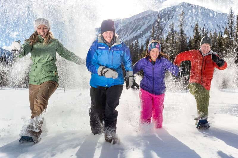 From Banff: Snowshoeing Tour in Kootenay National Park - Getting fitted with snowshoes at the Paint Pots trailhead