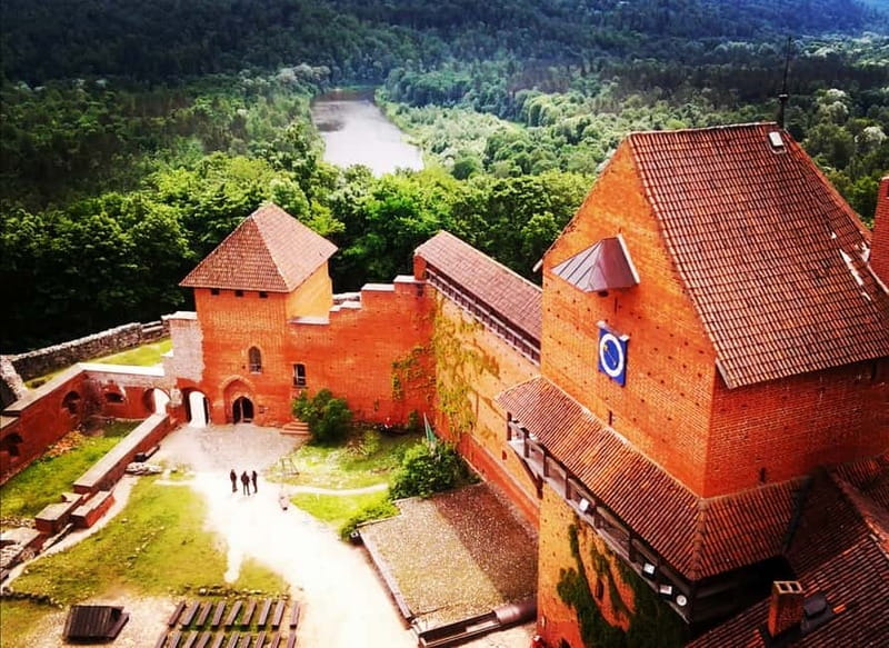 Riga: Private Sigulda, Turaida, and Gauja National Park Tour - Turaida Castle’s red tower in the woods