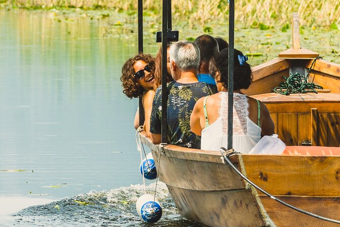 Skadar Lake National Park: Guided Boat Tour to Kom Monastery - A wooden boat through the first channels